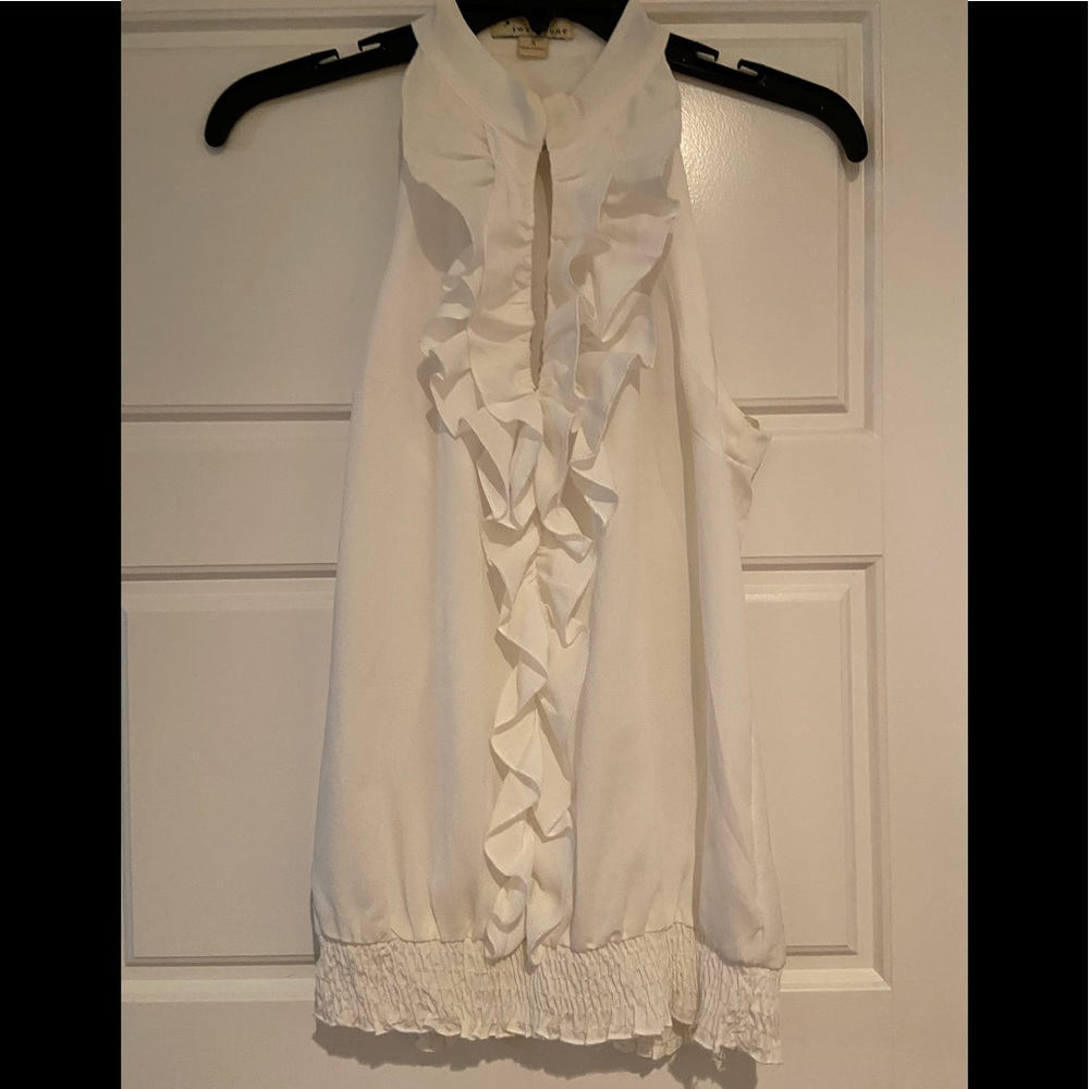 White ruffle blouse